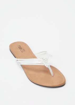 white strappy flip flops