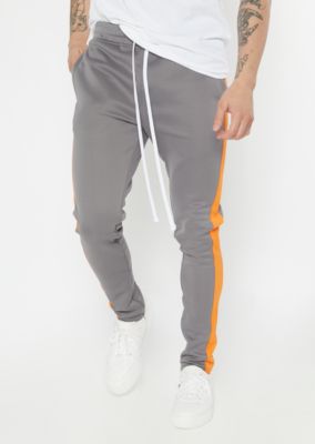 green and orange track pants